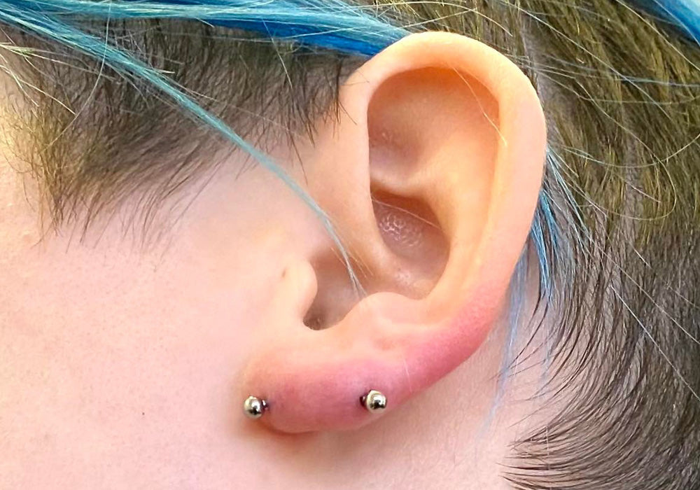 Transverse lobe ear piercing by Silver Lining Manchester